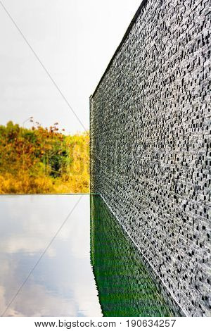 Dark grey stone tile dbrick wall backgrounf