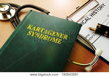 Book with title Kartagener syndrome on a table.