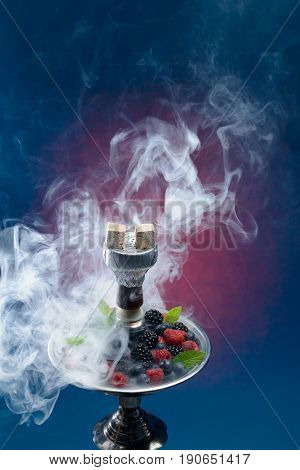 Closeup of hookah with tray full of berries