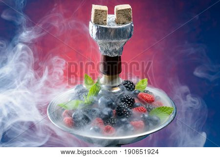 Closeup of hookah with tray full of berries