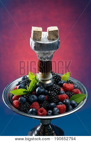 Closeup of hookah with tray full of berries