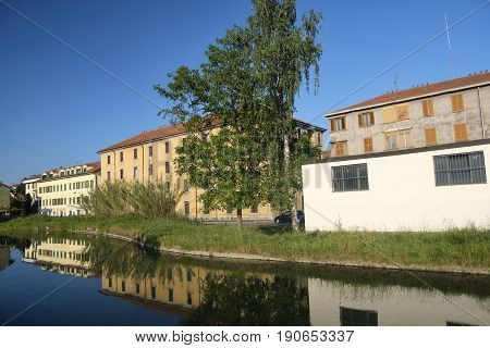 Cycling lane along the Naviglio Pavese from Pavia to Milan (Lombardy Italy) in the springtime. Buildings