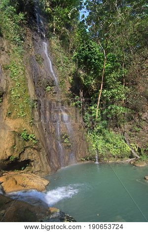 Waterfalls and turquoise green pool surrounded by lush tropical vegetation at La Conchuda waterfall in Rio la Venta Canyon Chiapas Mexico