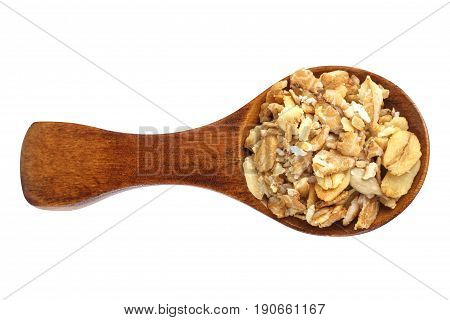 Muesli in wooden spoon over white background.