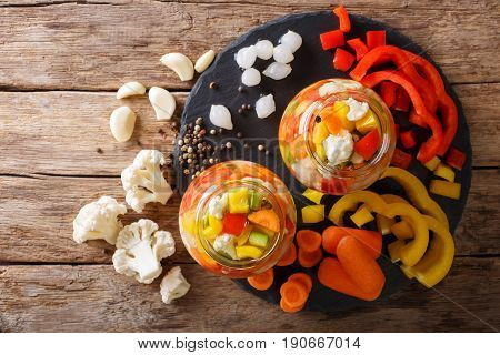 Spicy Homemade Pickled Giardiniera With Peppers, Carrots And Cauliflower. Horizontal Top View