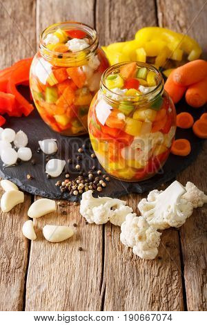 Italian Giardiniera Salad Of Pickled Cauliflower, Pepper And Carrots Close-up. Vertical