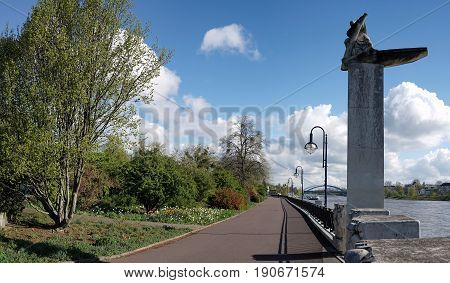 MAGDEBURG, GERMANY - APRIL 19, 2017: Promenade on the bank of the river Elbe in Magdeburg with the monument 