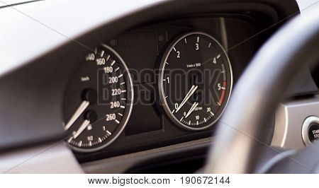 Inside picture of a luxury car and its board.