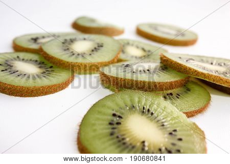 Kiwi Green With Black Small Bones. Pile On White Background