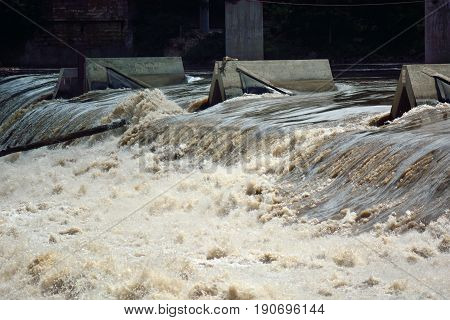 River Water Flowing Quickly Over an Overflow Dam