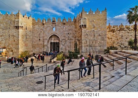 JERUSALEM, ISRAEL - DECEMBER 29, 2016: Damascus gate, nord entrance in old part of Jerusalem. Gate was built in 1537 by Suleiman the Magnificent with repairs to the turrets made in 2011 by Israel.