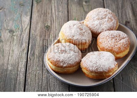 Delicious lush donuts berliners with powdered sugar