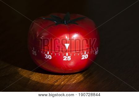 Mechanical Tomato shaped kitchen timer for cooking studying and working.