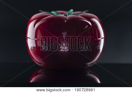 Mechanical Tomato shaped kitchen timer for cooking studying and working.