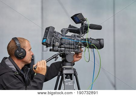 HODONIN, CZECH REPUBLIC - AUGUST 17, 2014: Cameraman recording the stage during the concerts of Made of Metal festival.
