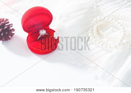 Wedding ring Diamond ring in red box. Selective focus with copy space