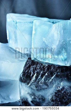 Ice With Stones.nature Background.melted Ice Cubes On The Rocks