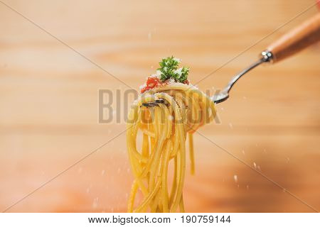 Close-up Of Asta Spaghetti With Tomato Sauce, Olives And Garnish. Italian Food.