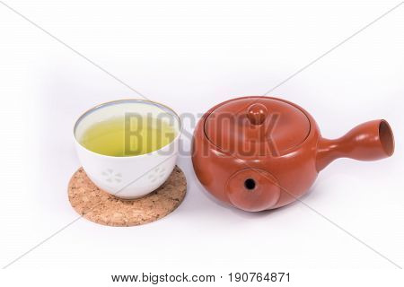 Hot green tea so delicious and teapot on white background