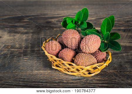 Lychees exotic fruits on a wooden background
