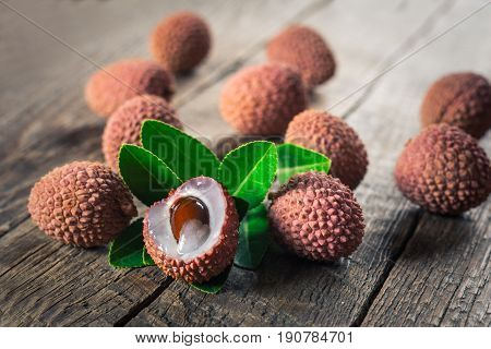 Lychees exotic fruits on a wooden background