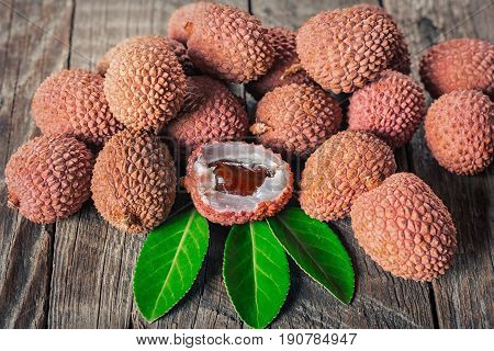 Lychees exotic fruits on a wooden background
