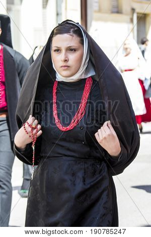 CAGLIARI, ITALY - MAY 1, 2017: 361 Religious procession of Sant'Efisio - portrait of a beautiful woman in traditional Sardinian costume - Sardinia