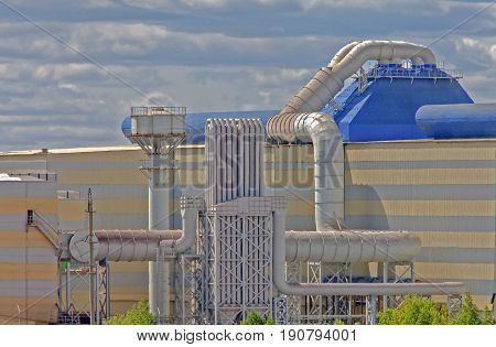 part of the factory industrial production on a background of clouds the plant some part of the structures of the plant