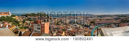 Lisbon Portugal. 05 June 2017.View of Lisbon town rooftops and tejo river from the Senhora do Monte viewpoint in Graca. Lisbon Portugal. photography by Ricardo Rocha.