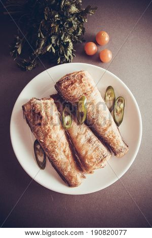 fried shad with chilli australian fish on grey