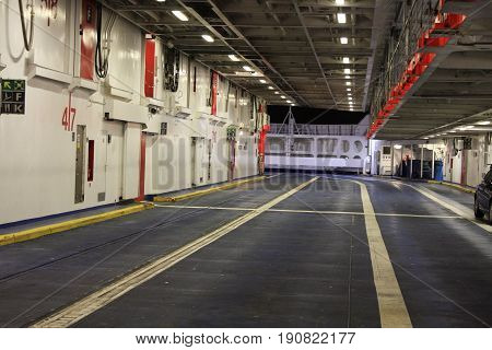 Car space inside of ferry boat .