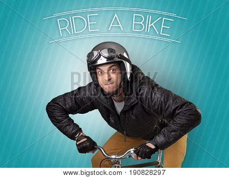 Kooky young guy on a bike with cyclist keywording and streaky background