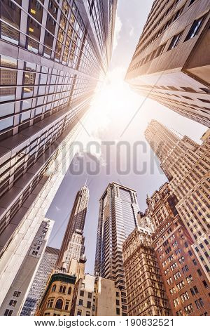 multiple skyskrapers in the sun seen from a low angle, Manhattan financial district, New York City