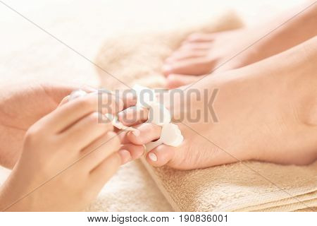 Female legs in pedicure salon