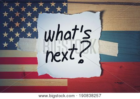 What's Next? on torn paper with Russian and American flag