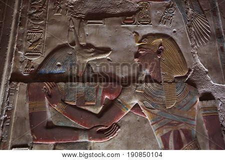 Anubis Depicted - ancient Egyptian god with jackal head. Anubis was the god of mummification. Temple to Osiris at Abydos, Egypt