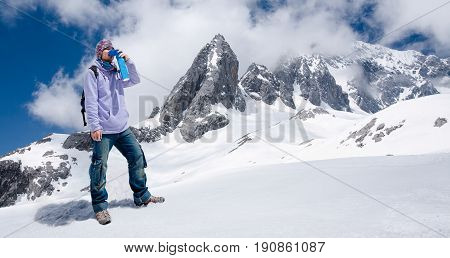 Climber Breathing With Mini Portable Oxygen Cylinger To Avoid And Treat Altitude Sickness Synptom
