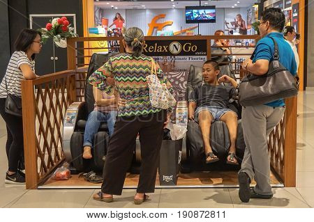 Kota Kinabalu,Sabah-May 29,2017:People relaxing in massage chair at Imago the shopping centre Kota Kinabalu,Sabah,Borneo,Malaysia.