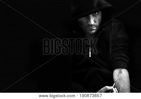 Dangerous Drug Addict Holding Syringe In Hands