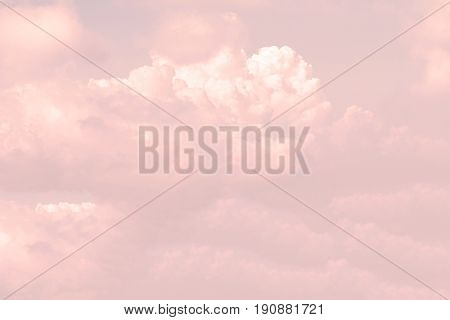 Sky background with white clouds and sun rays.