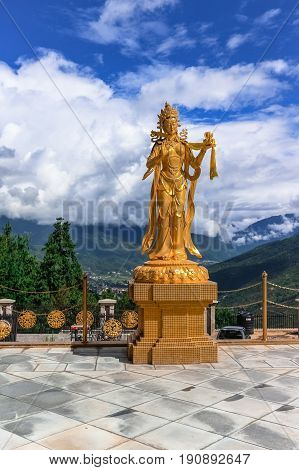 Golden statue of Buddhist female gods at Buddha Dordenma temple Thimphu Bhutan South Asia