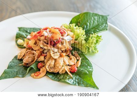 Crispy fish maw and dried shrimp in spicy salad