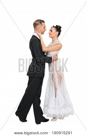 ballrom dance couple in love touching each other isolated on white bachground. sensual professional dancers dancing walz tango slowfox and quickstep