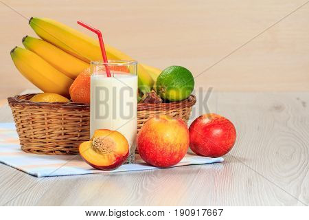 Glass Of Yogurt  With Mint And Fresh Strawberries, Nectarine, Lime, Banana On The Table