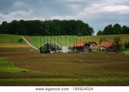 Rural alpine landscape with slovenian village in valley near Bled lake at spring sunny day. Slovenia.