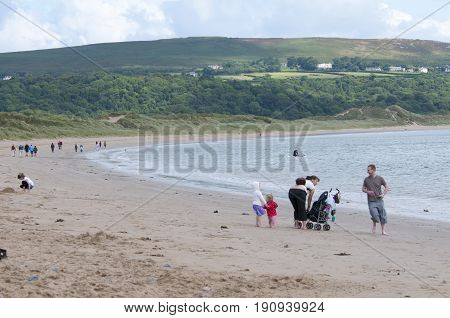 Oxwich beach, Wales, 14-08-2010: A bunch of people all relaxing on the beach in Wales.