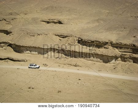 Four Wheel Drive Car in the Desert Wadi