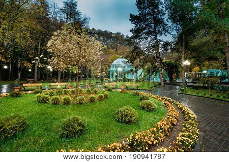 Borjomi, Samtskhe-Javakheti, Georgia. Hot Spring Of Borjomi Mineral Water In Pavilion. Famous Local Landmark Is City Park At Autumn October Evening.