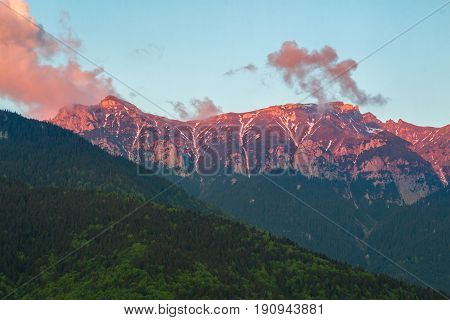 Majestic View With Sunset Light On The Snowy Bucegi Mount Peaks Carpathians Mountains Range Romania.