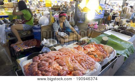 Chiang Mai: Thailand 27-May-2011: Two ladies hard at work at the market in Chiang Mai.
